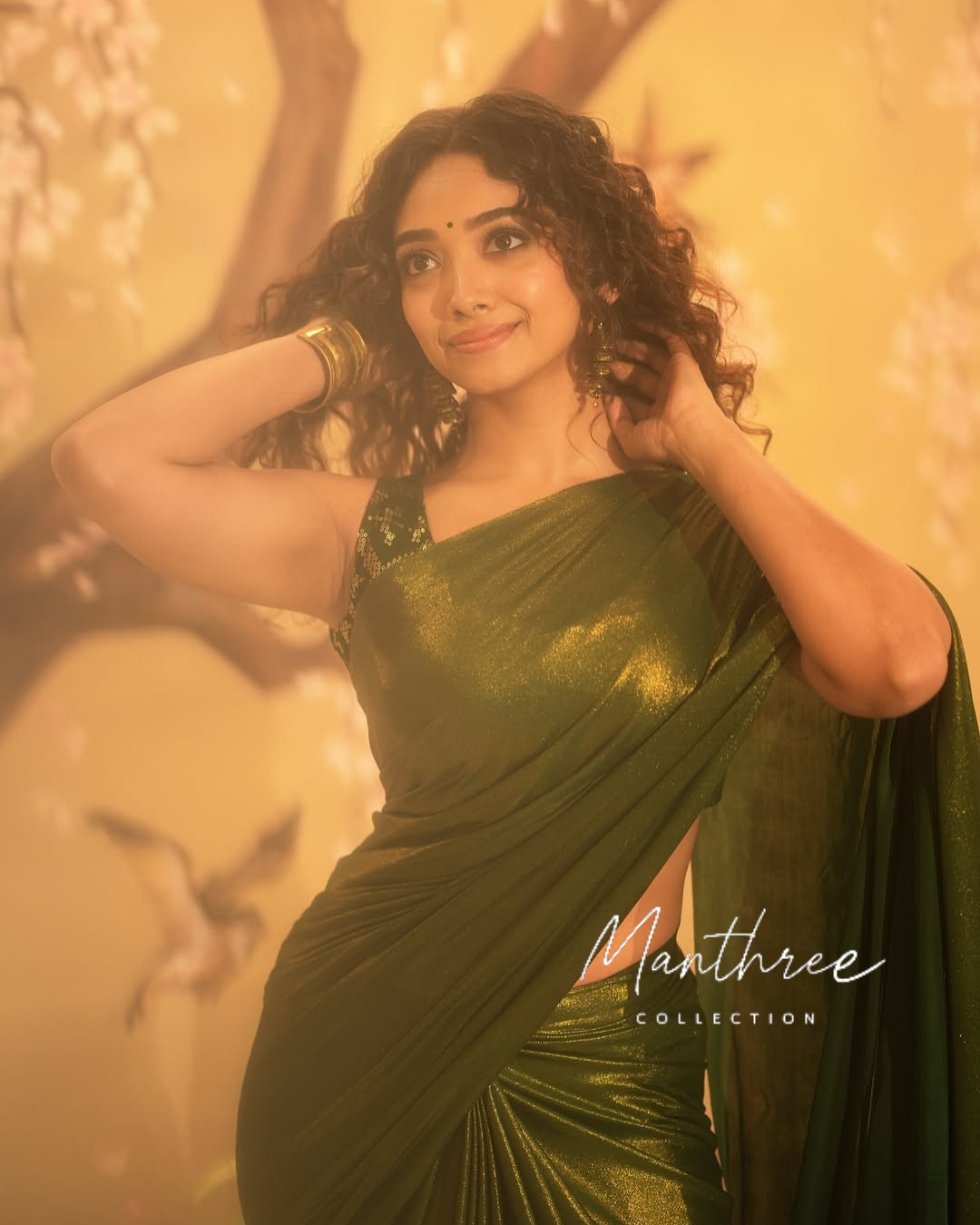 Saanve in a green saree