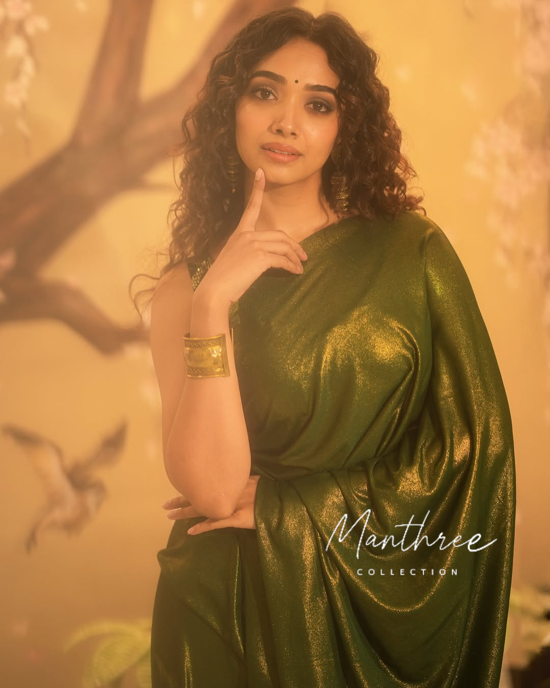 Saanve in a green saree