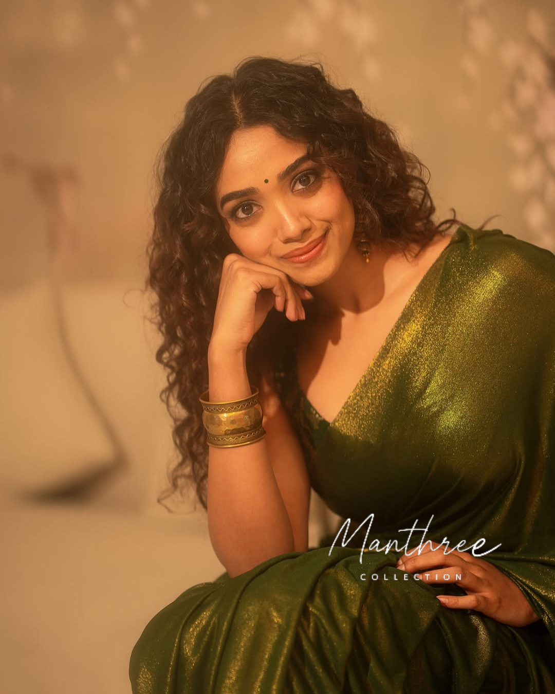 Saanve in a green saree