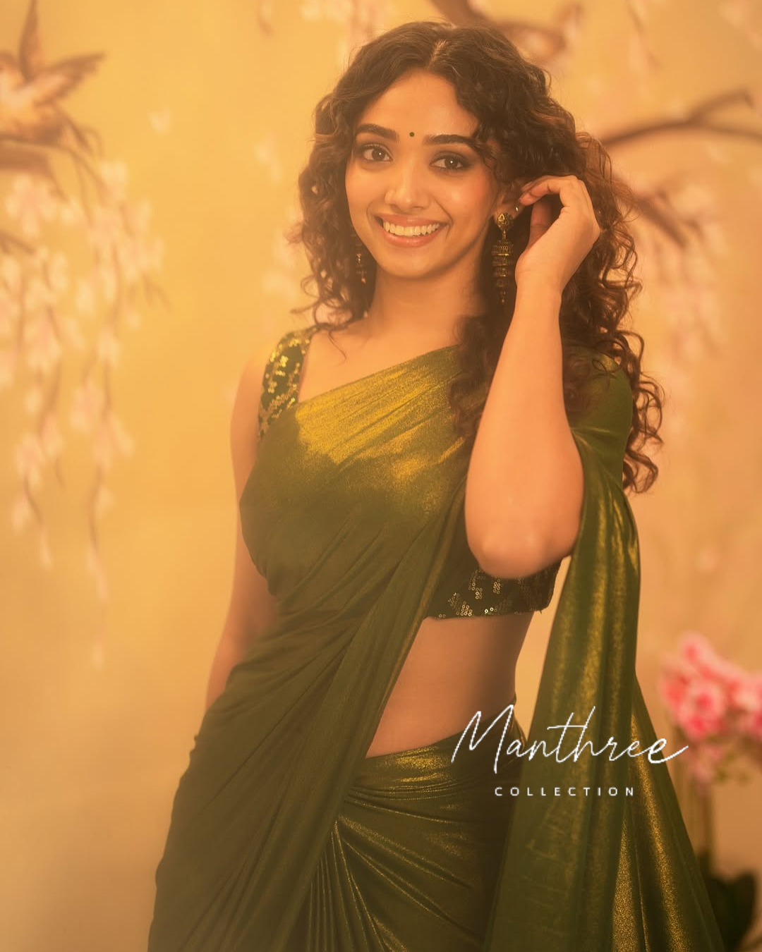 Saanve in a green saree