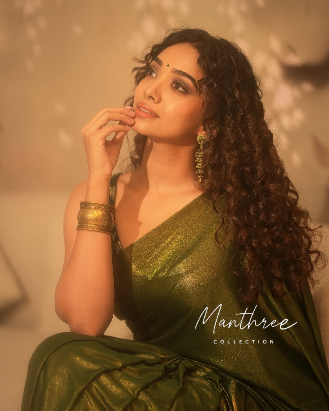 Saanve in a green saree