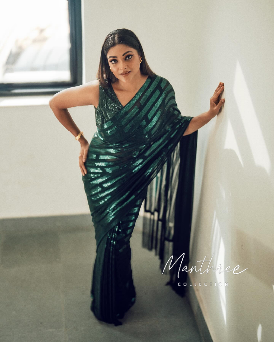 Abhirami green sequin saree