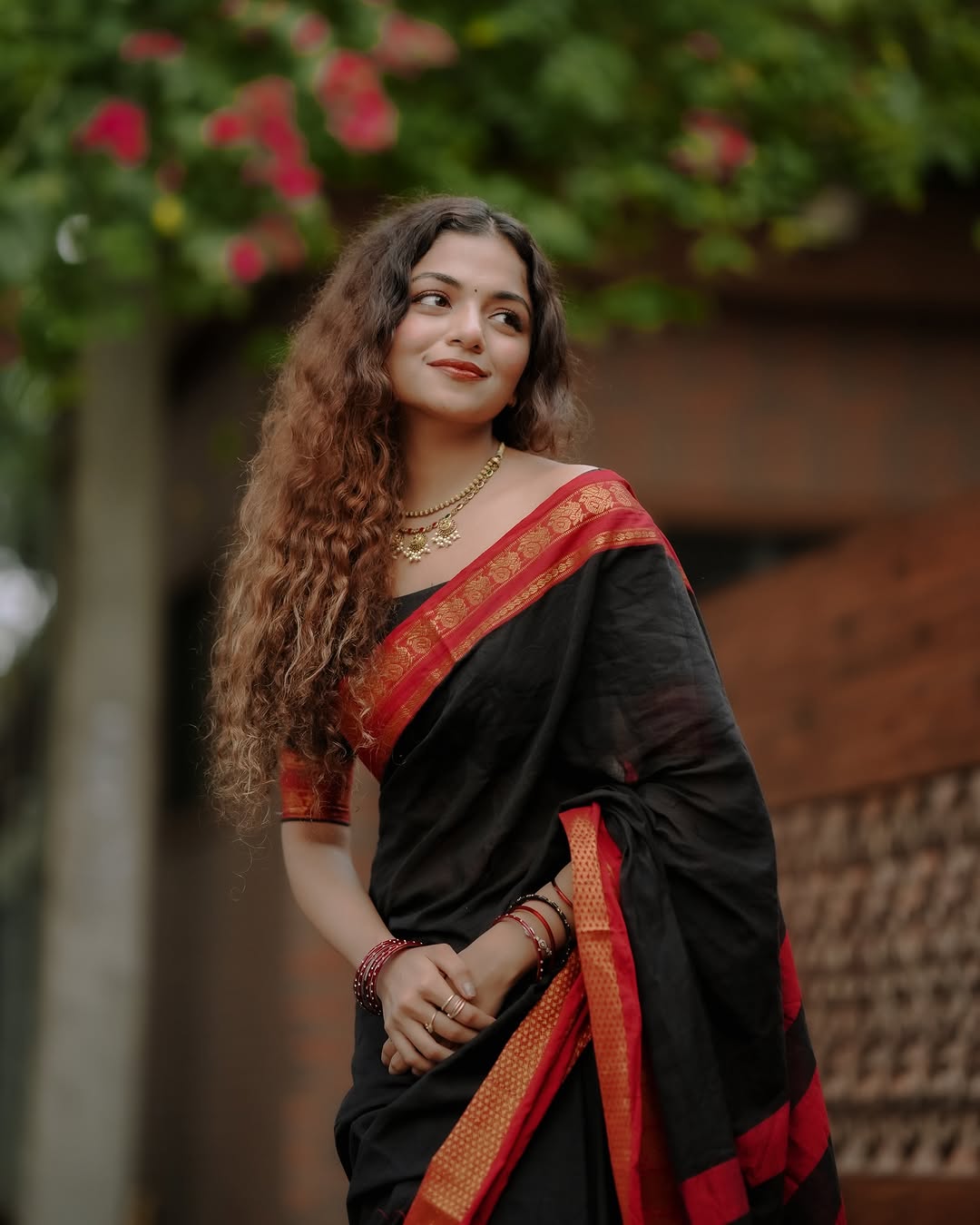 Manthree Kuthampully Handloom Black Cotton Saree with Peacock Motifs Border