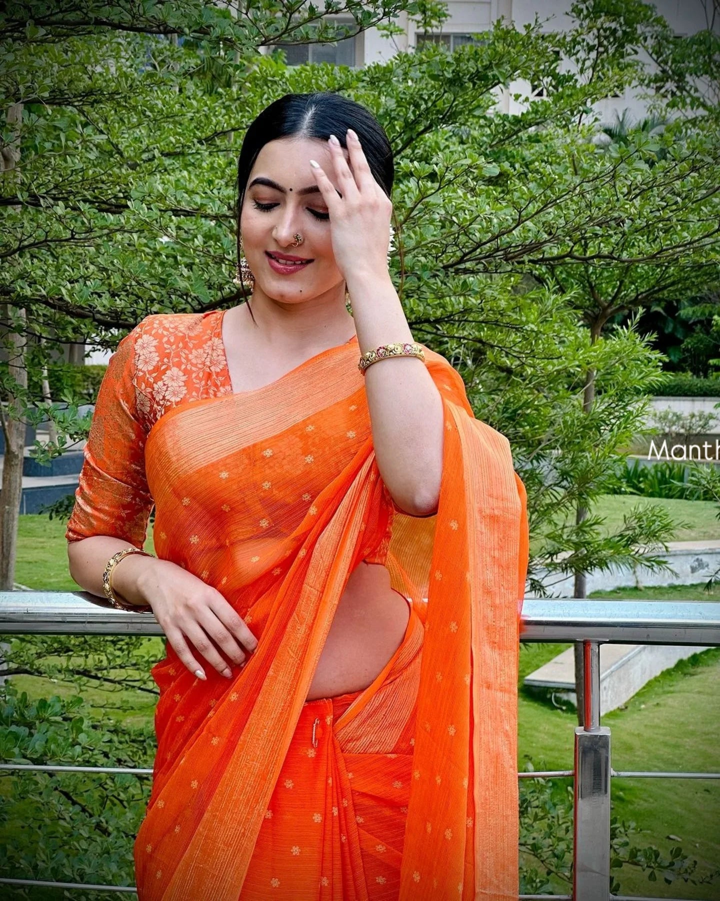 Trending celebrity orange designer saree