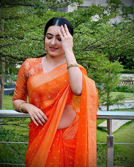 Trending celebrity orange designer saree