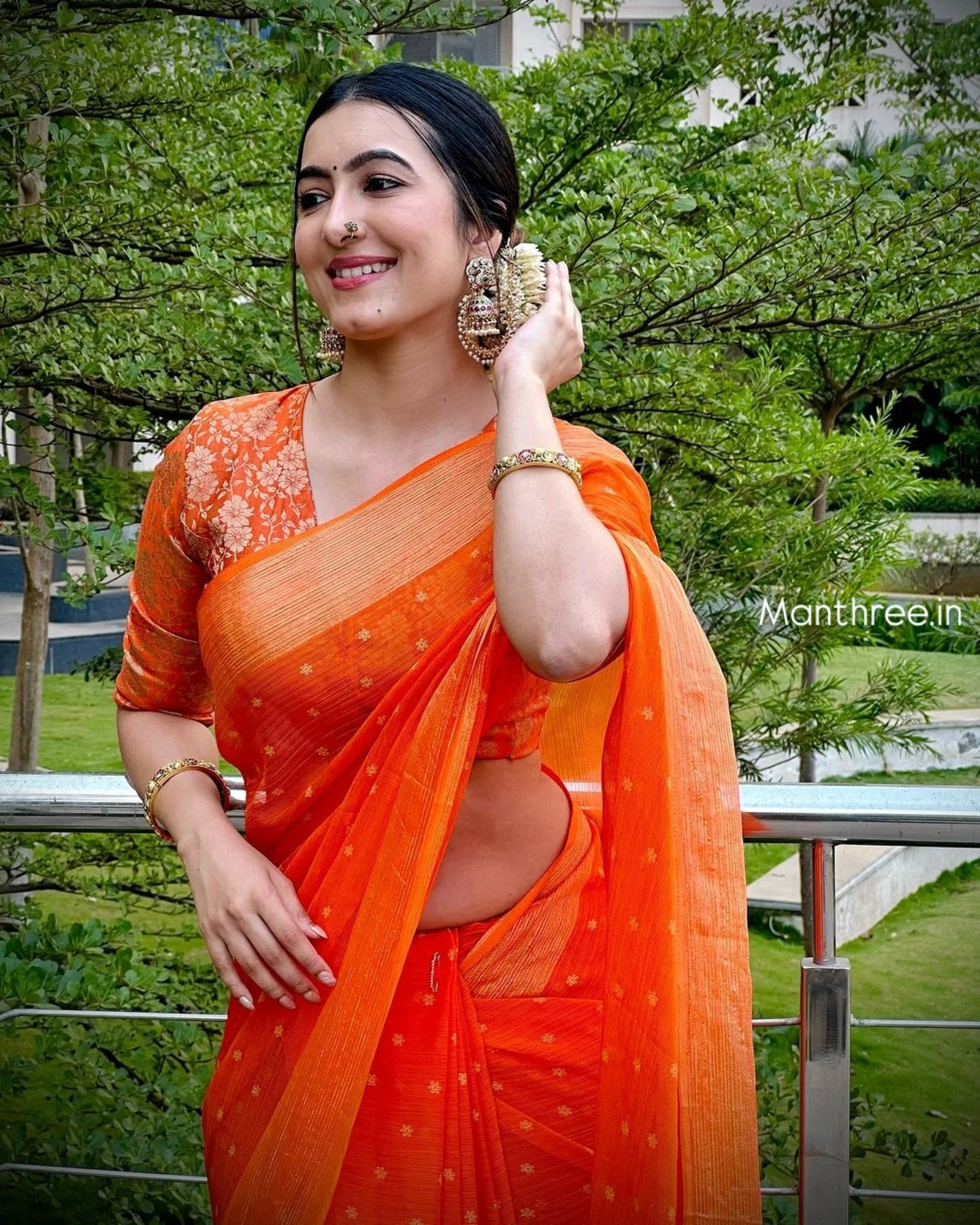Trending celebrity orange designer saree