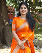 Neha Shetty orange silk saree