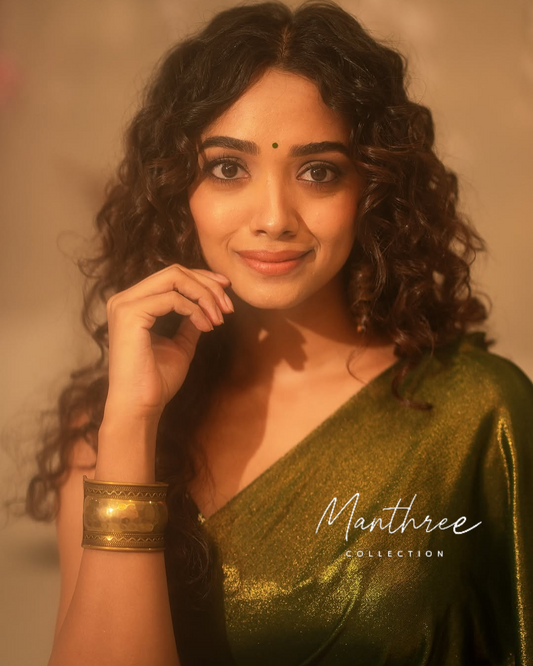 Saanve in a green saree